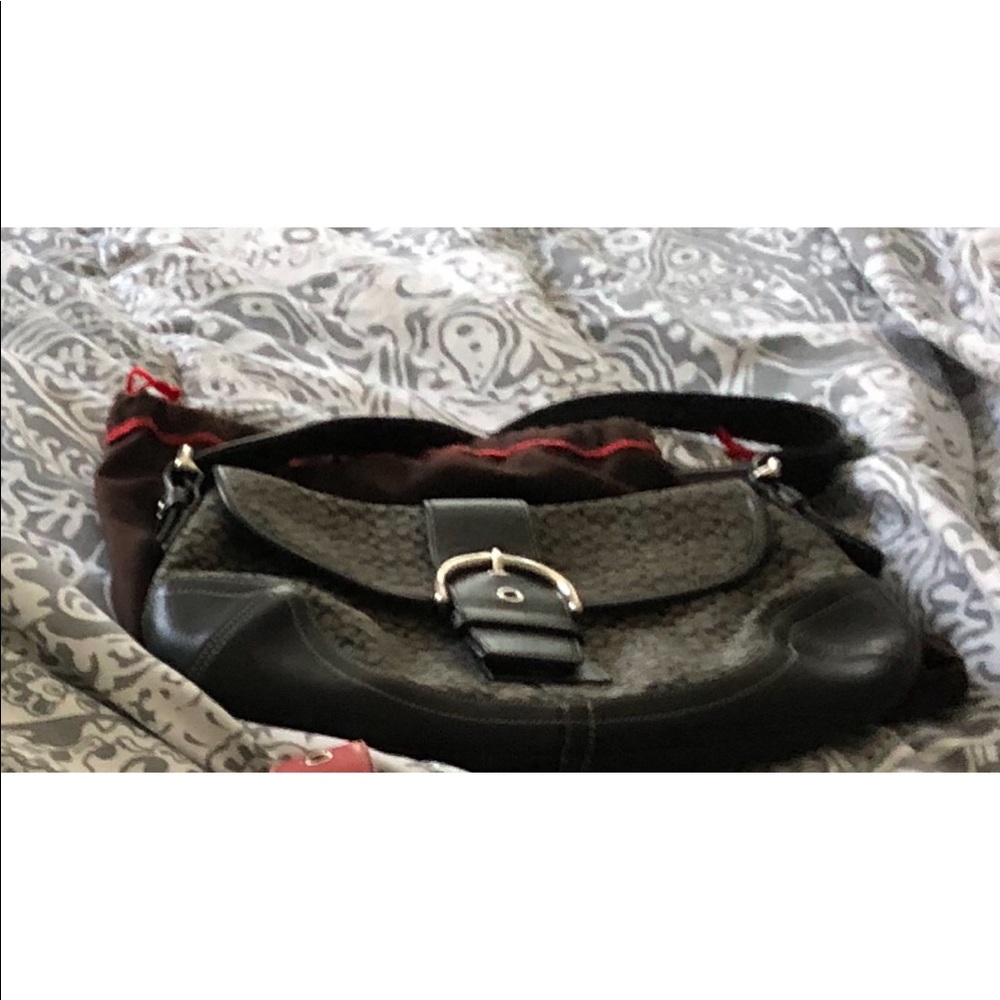 Black coach bag with dust bag.